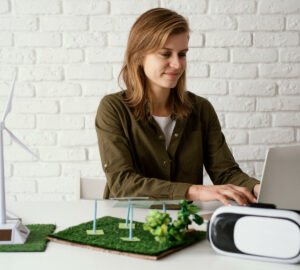Woman typing on a laptop.