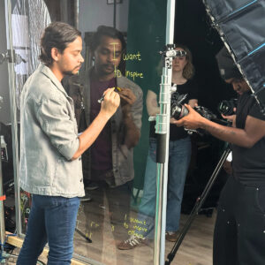 A behind-the-scenes photo from the Restart Stronger video shoot featuring Nakul, a Regent College London student.