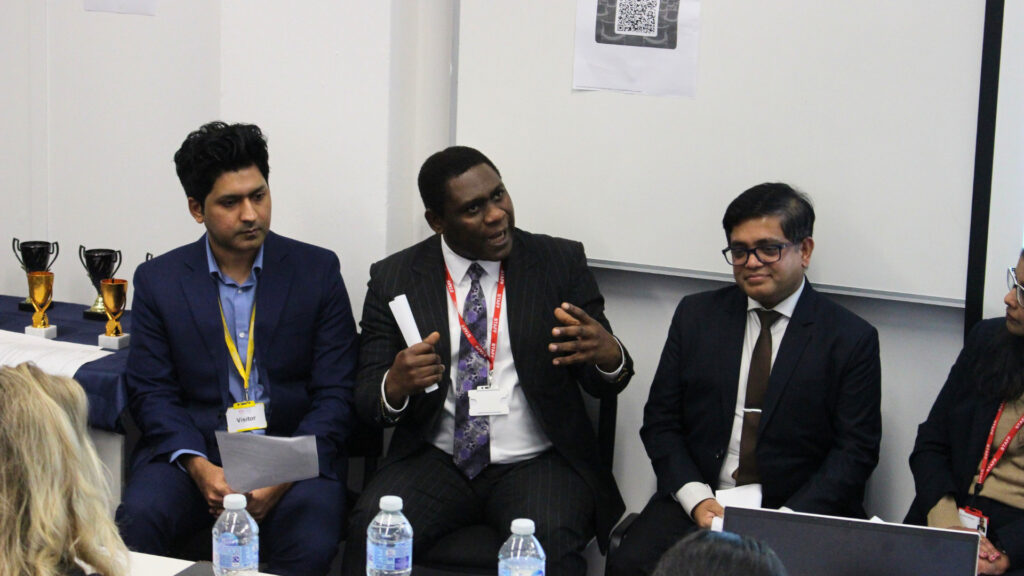 A panel discussion featuring School of Business students and staff.