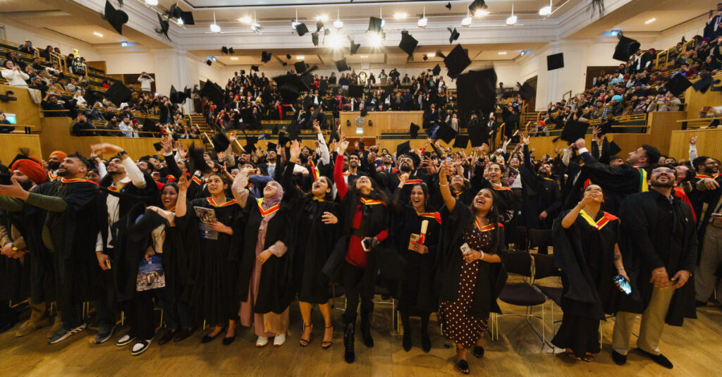 RCL's Winter 2026 graduates tossing their caps in the air to celebrate their academic achievements.