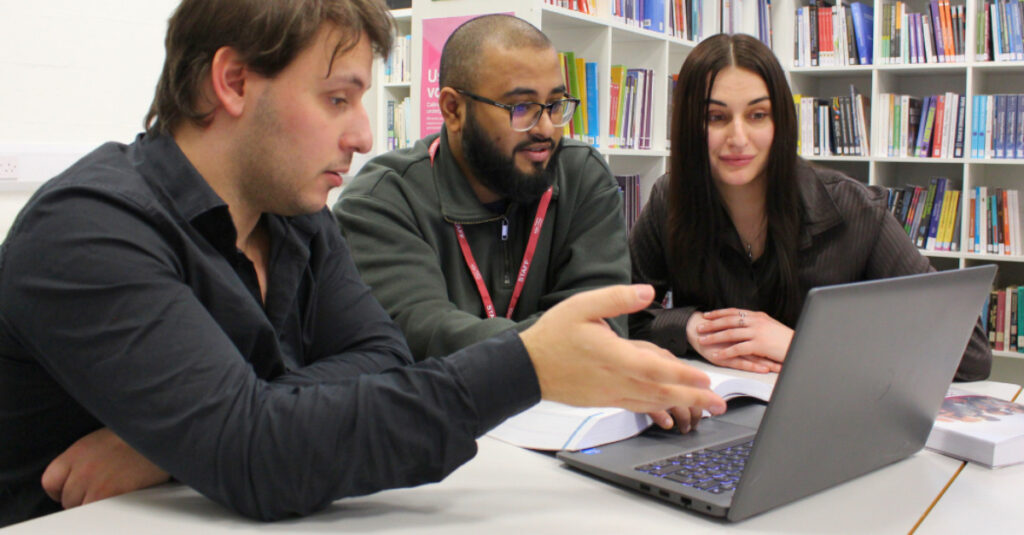 An RCL staff members guides students to make use the Virtual Learning Environment (VLE).