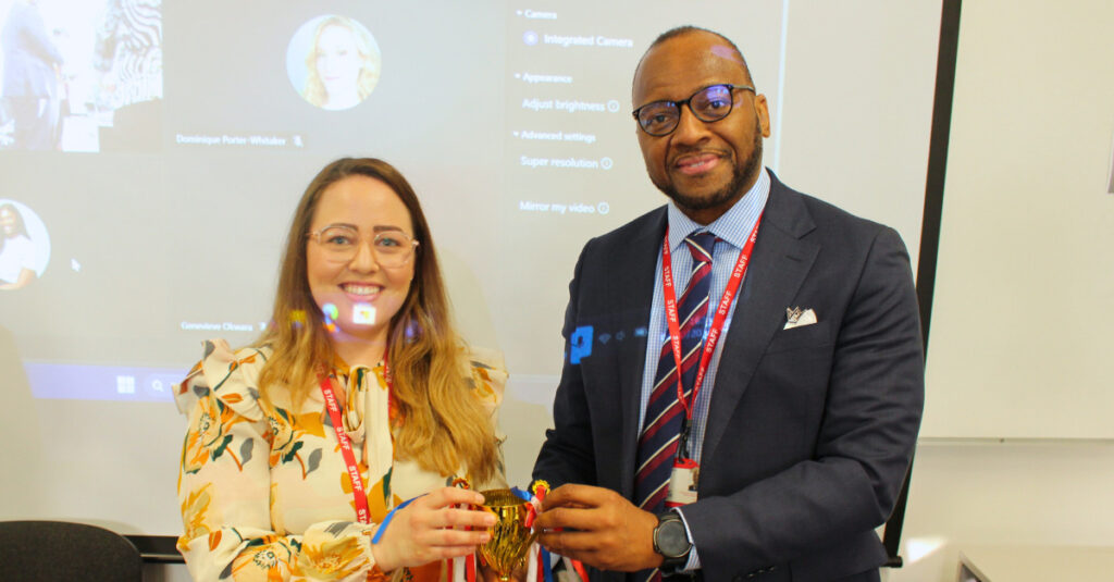 Saige Dhotman, Senior Lecturer in RCL's School of Health and Sports Science, accepting her award.