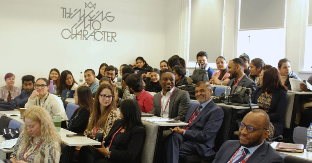 Attendees at RCL's School of Health and Sports Science make conversation in the Fitzrovia Campus Auditorium.