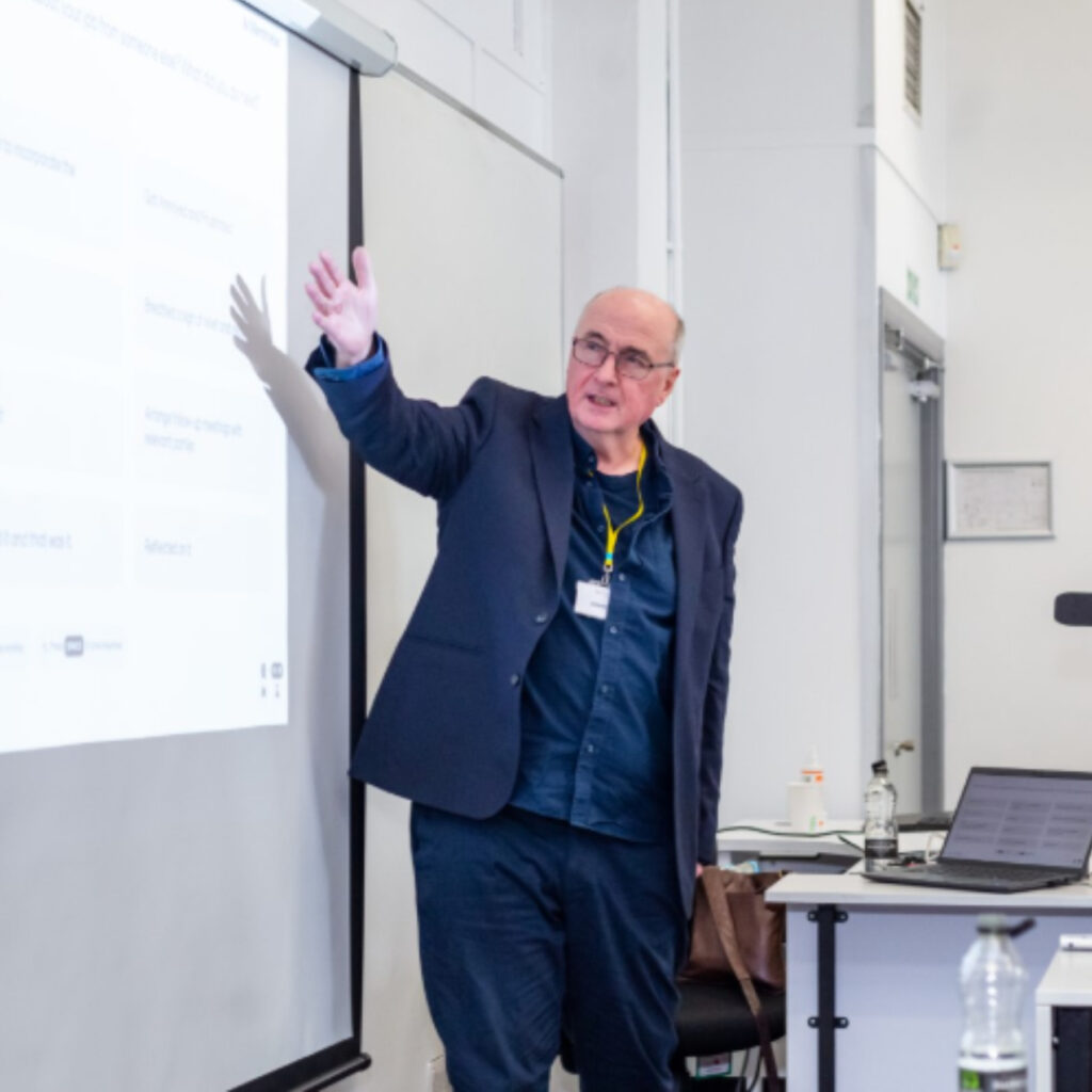 Professor Patrick McGhee, Assistant Vice Chancellor at the University of Greater Manchester, delivering his keynote, “The Psychology of Feedback”.