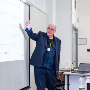 Professor Patrick McGhee, Assistant Vice Chancellor at the University of Greater Manchester, delivering his keynote, “The Psychology of Feedback”.